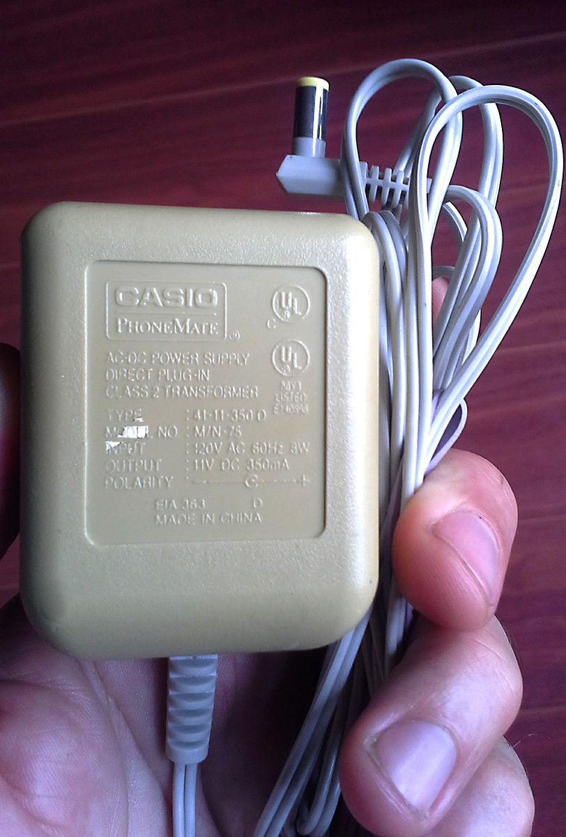 AC Adapter Power Supply Casio Phonemate 41-11-350D M/N75: 11V 350mA Model: 41-11-350D M/N75 Output Voltage: 11V Cou