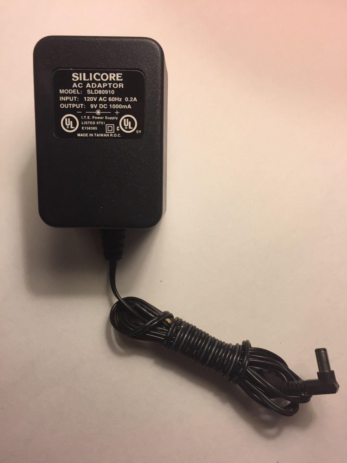 Silicore AC Adapter, Model SLD80910 Input:120VAC 60 Hz 0.2A Output: 9VDC 1A Brand: Silicore Output Voltage: 9 V Mode