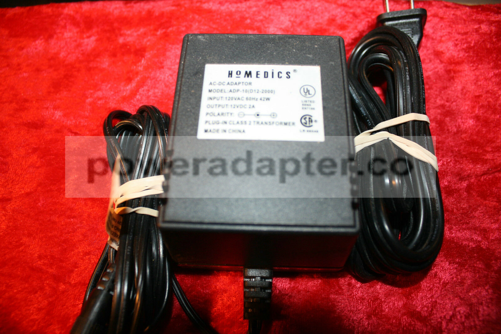 HoMEDICS ADP-10 (D12-2000) AC-DC Adaptor - IN: 120VAC, Out: 12VDC, 2A Condition: Used: An item that has been used pr